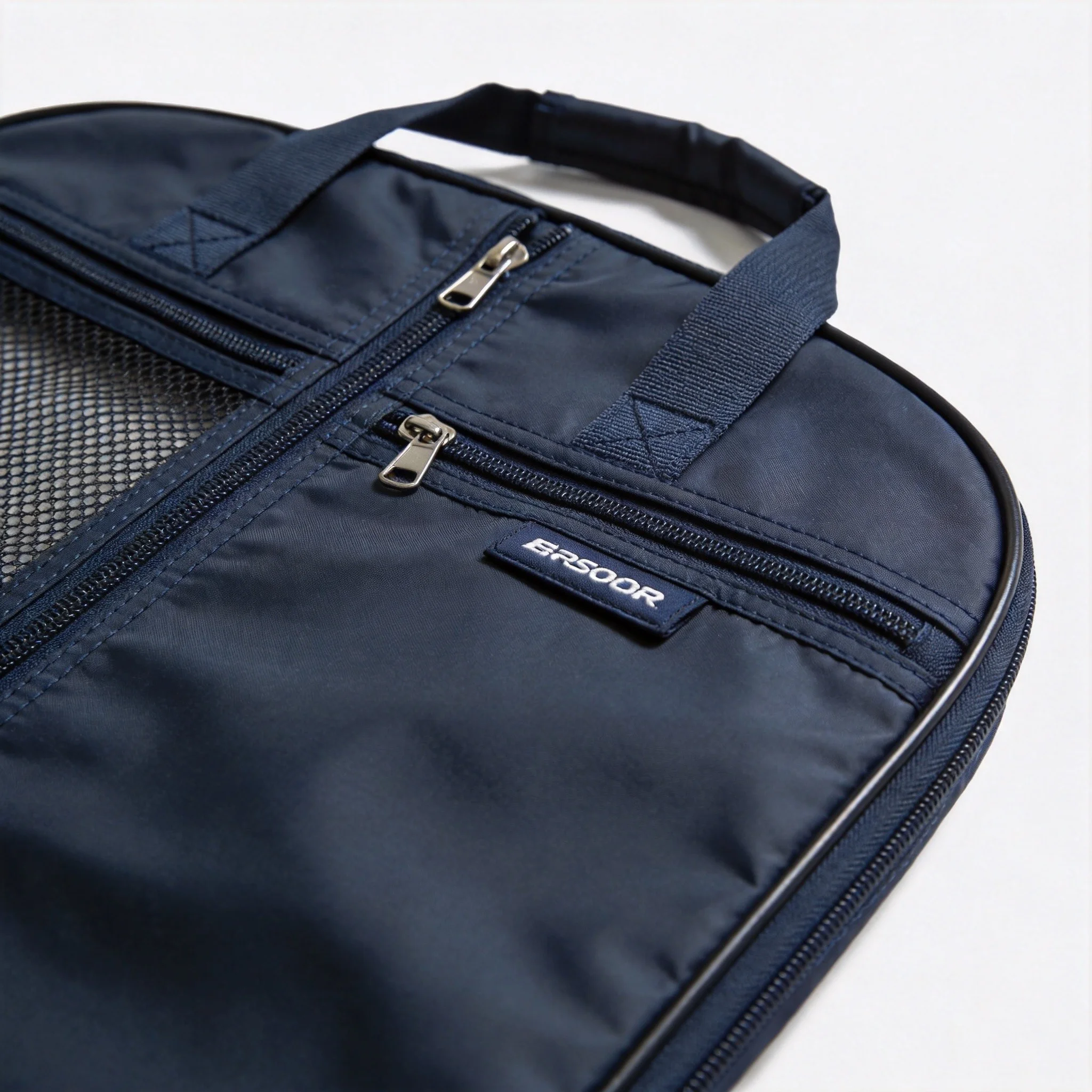 Custom garment bag close-up showing breathable mesh panel, YKK zipper, and reinforced stitching quality
